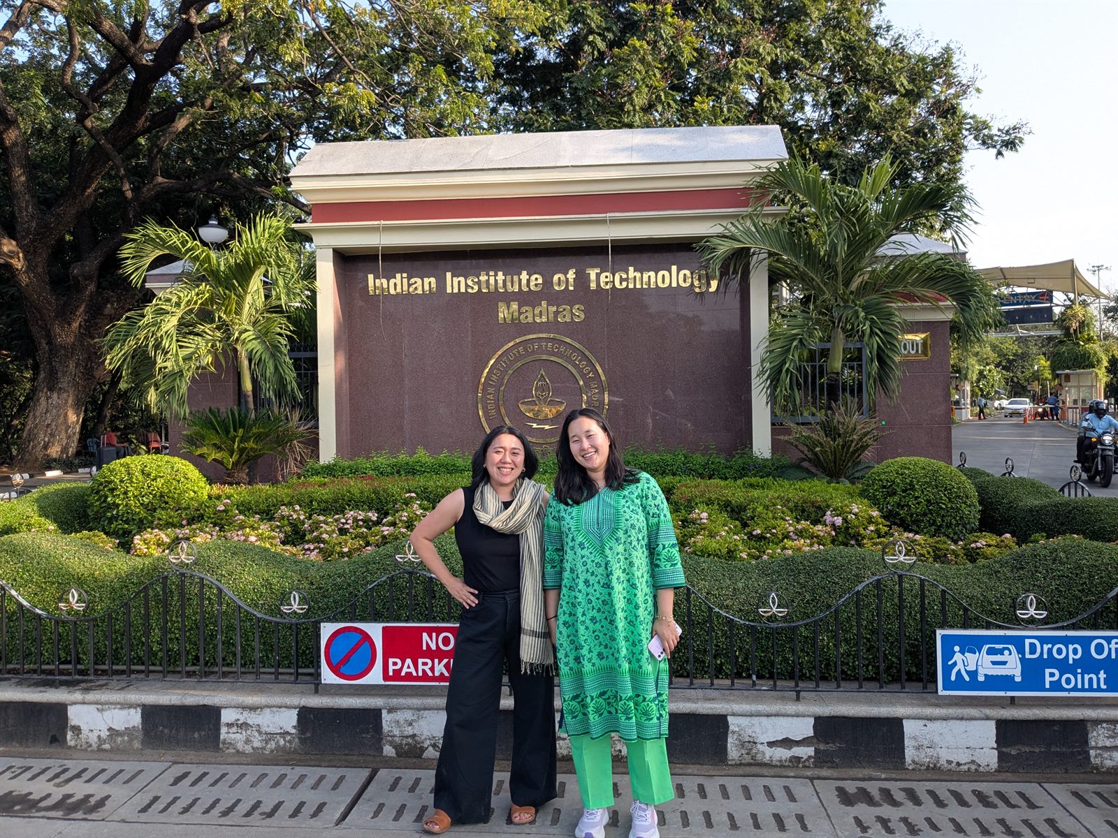 Two women in front of the IIT Madras front gate