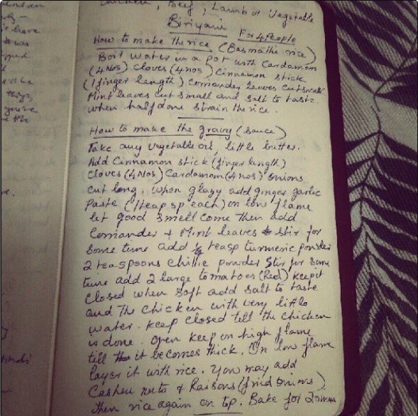 A sheet of paper with a biriyani recipe written out by hand